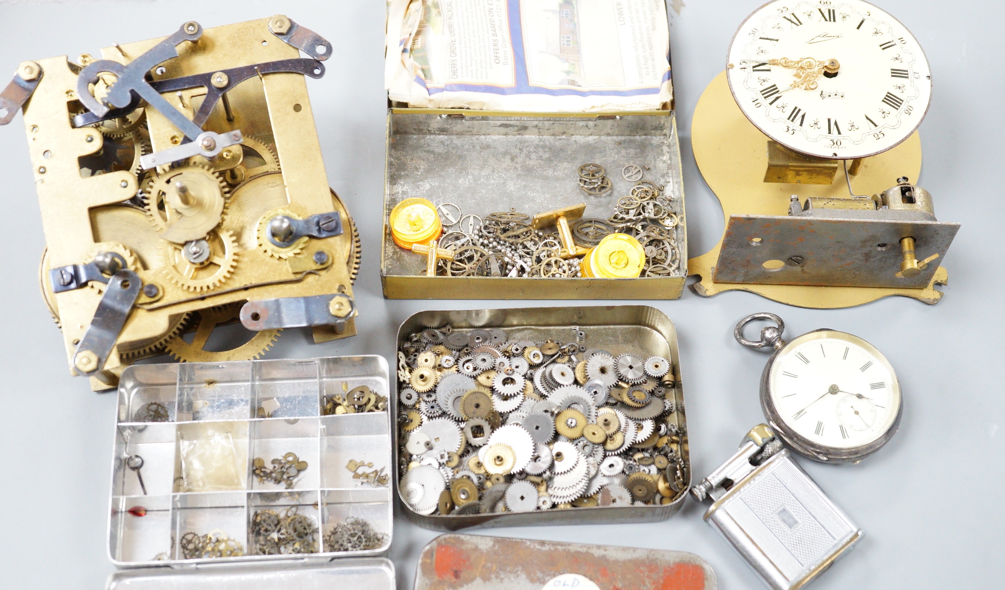A silver pocket watch, various wrist watches and watch and clock parts and movements